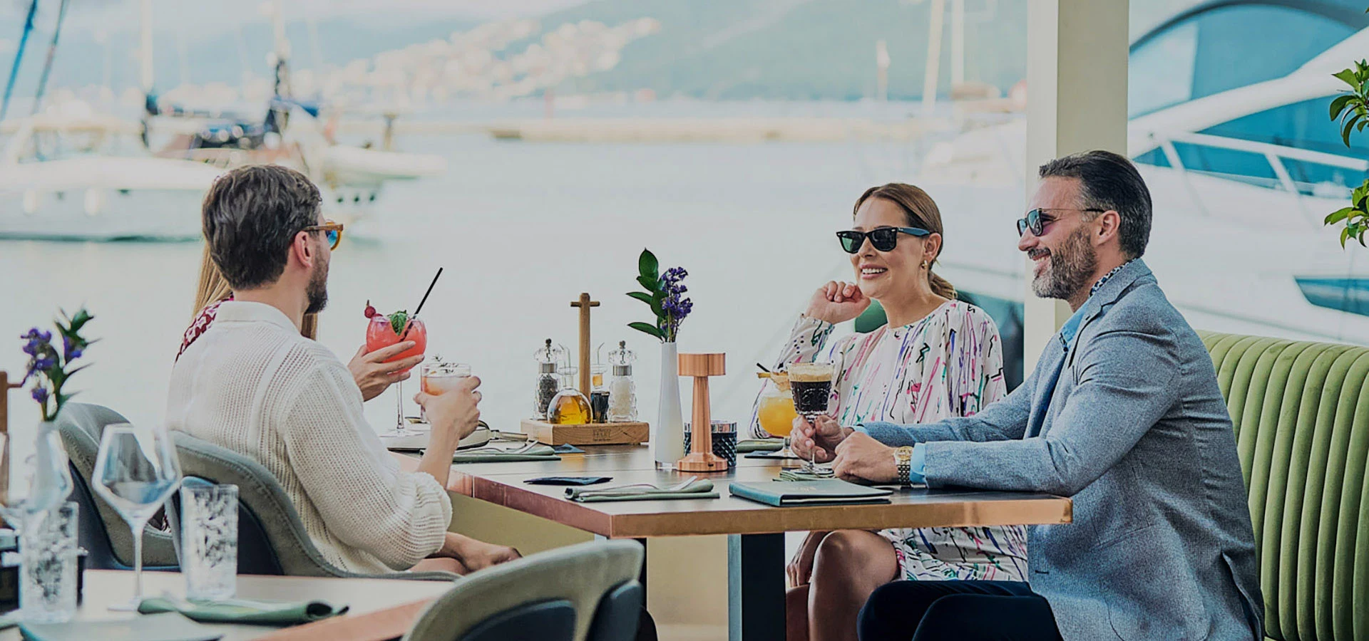 Group-of-friends-enjoying-a-fancy-meal-by-the-marina-in-Portonovi-Montenegro
